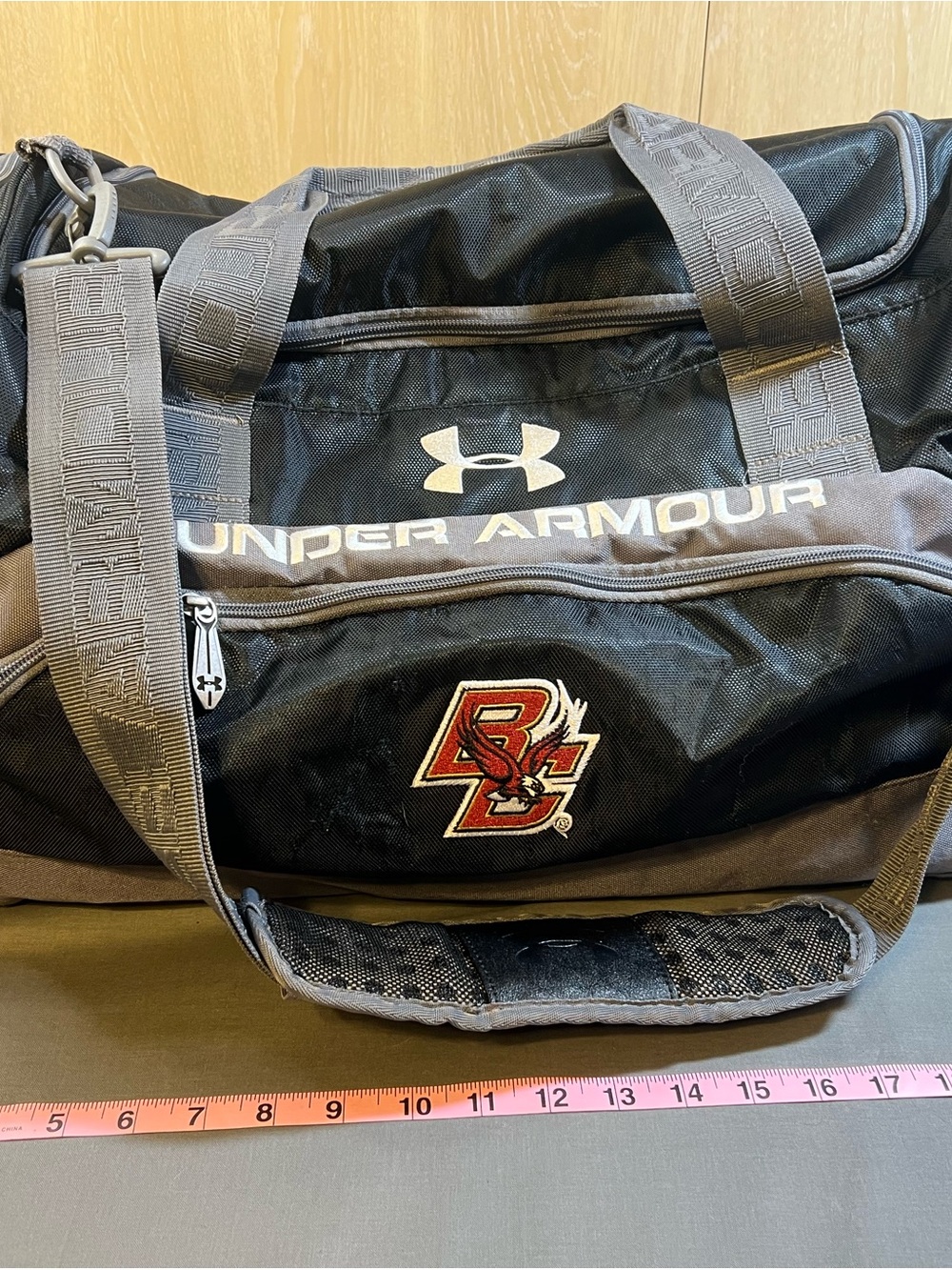 Under Armour Black and Gray Duffel Bag with Red Boston College Logo